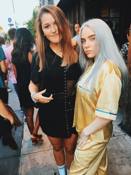 Chelsea Cutler poses a picture with Billie Eilish.